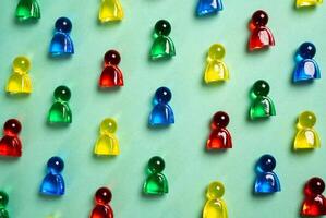 Lots of colorful figures. Sociality and public. Candidates for employment. Acquiring talent. Human resources. HR, social dynamics, inclusion, public engagement, and organizational development. photo
