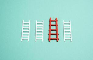 The red ladder stands out among others. The concept of the best of the options and plans. Credit for business. Most effective plan or optimal solution. photo