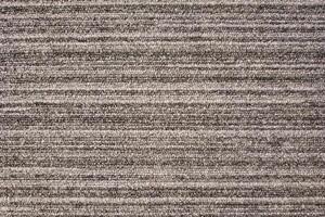 Close-up of a gray striped carpet with a textured, woven pattern.Close-up of a gray striped carpet with a textured, woven pattern. photo