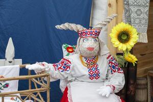 The symbol of Belarusian culture is a goat doll in national clothes. photo