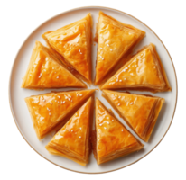 Traditional baklava pastry cut into triangular slices arranged in circle, isolated on transparent background png