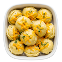 Overhead Shot of Golden Dumplings Topped with Shredded Cheese and Thyme in a White Square Bowl png