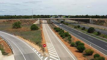 Highway interchange with vehicles moving along lanes video