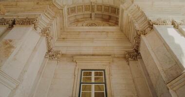 Overview inside marble triumphal arch in classicism style, movement from bottom to top photo