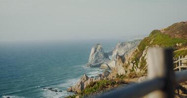 Panoramic view of sea washing the rocky shores and ledges. View from the top of the mountain from the observation deck photo