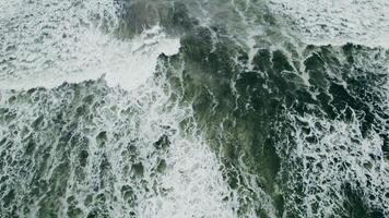 Aerial drone shot of turbulent sea waves at high tide. Full-frame ocean texture with no land visible photo