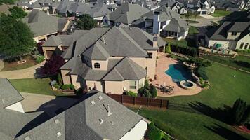 The drone is flying over the cottage area. The architecture of low-rise buildings in America. Summer day photo