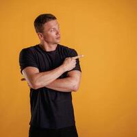 Invisible copy space, arms. ...Man is against background in the studio photo