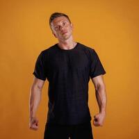Man is against background in the studio. photo