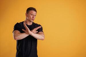 Stop, don't, hands ,gesture. ..Man is against background in the studio photo