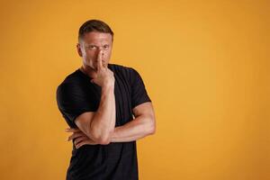 Thoughtful ,facial expression... Man is, against background in the studio photo
