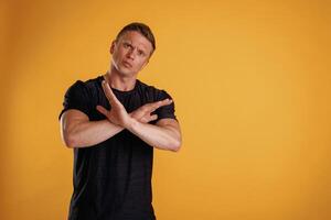 Stop, don't, hands gesture. ,Man is against background in the studio photo