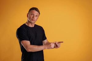 Copy space, concept, showing, pointing.,, Man is against background in the studio photo