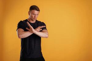 Stop,, don't,,, hands gesture. Man is against background in the studio photo