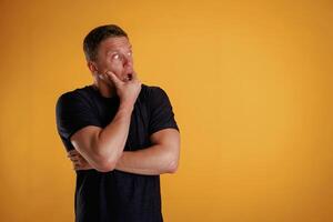 Scared,, feeling,, stressful. Man is against background in the studio photo
