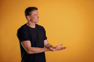 Invisible copy ,space,, arms. Man is against background in the studio photo