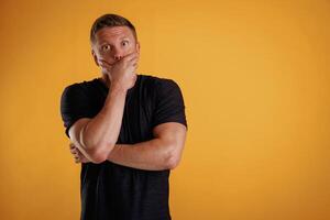Scared, feeling ,,stressful. Man is against background in the studio photo