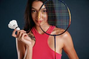 Hobby conception,,, badminto,n player. Beautiful young woman is against background photo