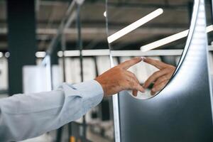 Touching,, trying smart mirror... Man is in the hardware shop photo