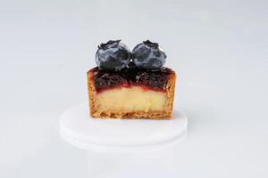 Made by professional baker. Delicious tart ,with blueberries against white background photo