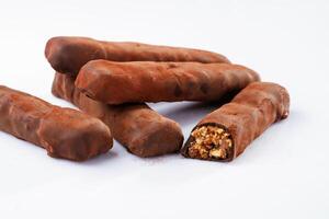 Chocolate ,bars lie on a white surface, isolated photo