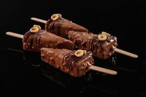 In the form of ice cream. Tasty cheesecakes on the black background photo