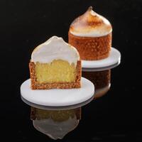Front view, close up. Delicious ,,cake, against black background photo