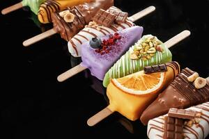 Organized on the surface. Tasty ,,cheesecakes on the black background photo