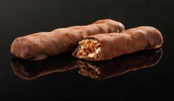 Close up ,view... Crispy and sweet chocolate bars on black background photo