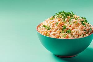 A bowl of carrot salad with parsley on a green background photo