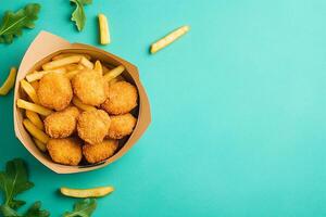 Top View Of Kids Meal With Chicken Nuggets And Fries On Vibrant Background With Copy Space, Food Photography photo