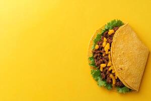 Top View Of Crunchy Beef Taco With Lettuce And Cheese On Vibrant Background With Copy Space, Food Setting photo