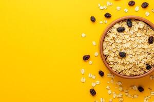 Top View Of Oatmeal With Brown Sugar And Raisins On Vibrant Background With Copy Space, Food Image photo