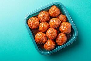 Top View Of Pre-Packaged Meatballs On Vibrant Background With Copy Space, Food Image photo
