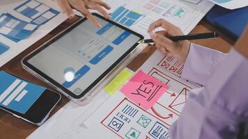A person is working on a tablet with a pen and paper video