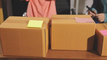 Three boxes with sticky notes on them sitting on a table video