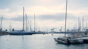 A marina with many boats docked in it during a cloudy day video