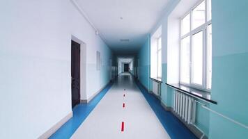 Modern hallway in educational center. Long corridor in blue color with doors and large windows in the university. video