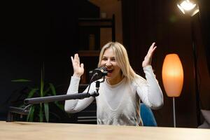 Radio host speaking with energy during a live podcast recording. photo