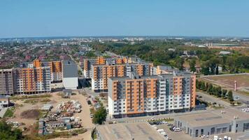 Construction of new residential buildings. Modern complex of bright block of flats built in the outskirts of the city. Apartment houses. Aerial view. video