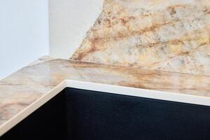 Experience the elegance of a finely designed corner with a unique stone texture for any space photo