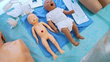 Baby dolls for medical practice. Child dummies on the table for students studying purpose in medical university. video