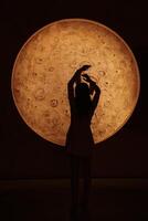 The Silhouette of Hands is posed against a Glowing Orb, enhancing atmosphere and appeal photo