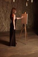 An Elegant Artist Engaged in Creative Work Within a Timeless and Inspiring Studio Setting photo