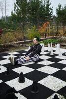 A Fascinating and Creative Scene of Chessboard with Striped Attire, a Playful Visual photo