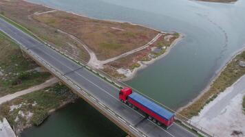 Aerial view of vehicles moving over the bridge video