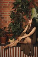 An Exquisite and Artistic Pose Surrounded by Lush Greenery in a Beautiful Rustic Setting photo