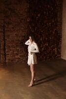 Surreal Fashion Photography Featuring a Floating Model in an Artistic and Creative Setting photo