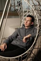 Enjoy modern relaxation in a uniquely designed hammock setting that provides tranquility photo