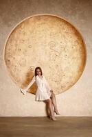 An Elegant Pose Against a Circular Backdrop in Soft, Neutral Tones Exuding Calmness photo
